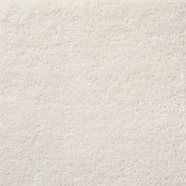 Vanilla cream carpet swatch showing a softly nubby, mottled pile