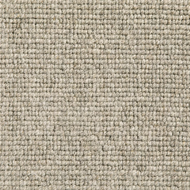 Close-up of warm greige Senecio with dense looped weave and subtle flecking