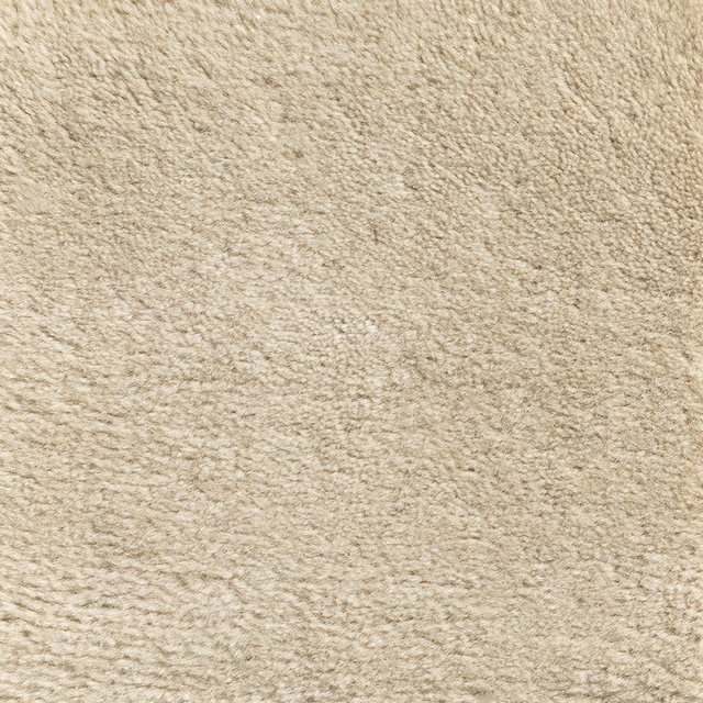 Close-up of warm oat-beige Pampas carpet with irregular softly raised textured pile