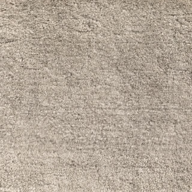 Warm taupe-grey carpet with a dense, finely mottled textured surface
