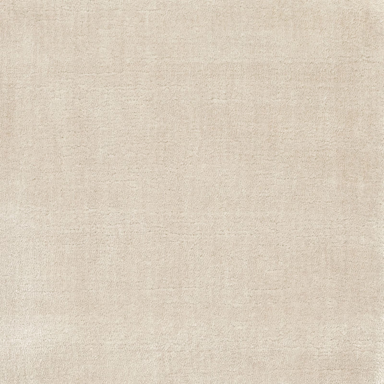 Pale shell-beige carpet swatch with a softly mottled, fine woven texture