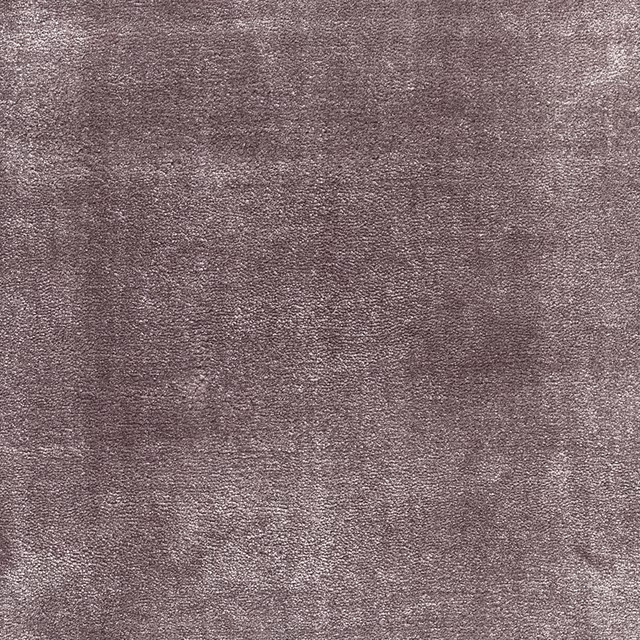 Mottled dusty amethyst carpet surface with fine taupe-purple texture