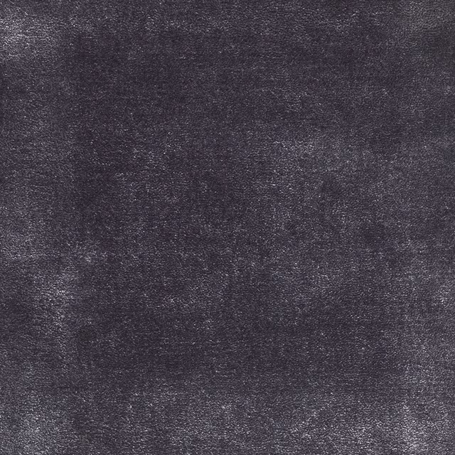 Deep charcoal-grey carpet textile with a softly mottled, granular surface