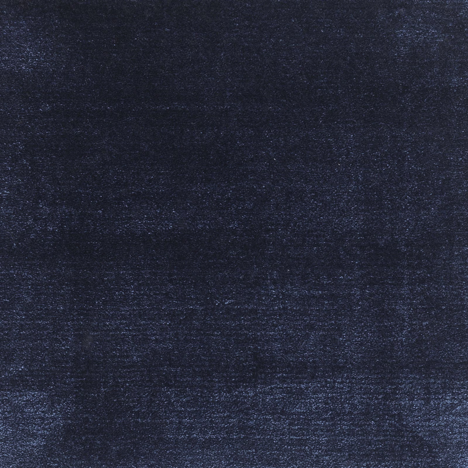 Deep navy textile with subtle blue-grey flecks and irregular horizontal texture