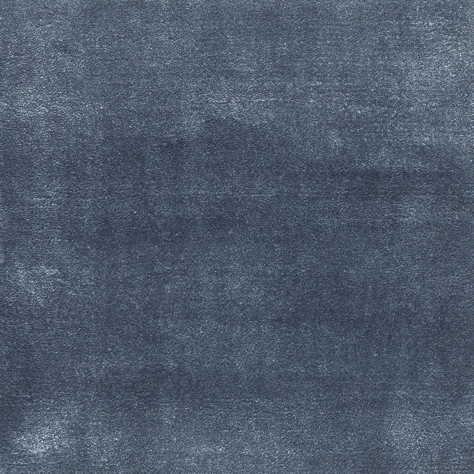 Deep sapphire blue-grey carpet with softly mottled, tactile surface texture