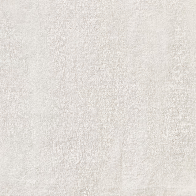 Warm ivory-white Kheri carpet textile with fine irregular texture and subtle vertical shading