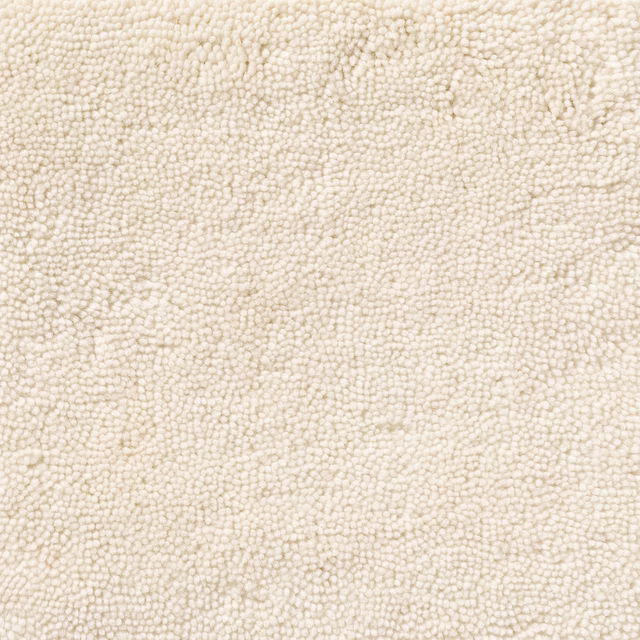 Warm ivory looped textile with a softly uneven, nubby bouclé-like surface