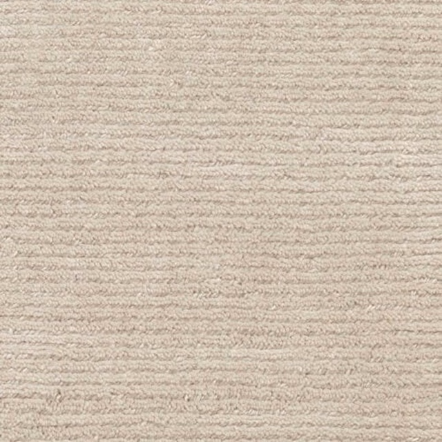 Warm pale-grey Rampur carpet with softly ridged horizontal texture and taupe flecks