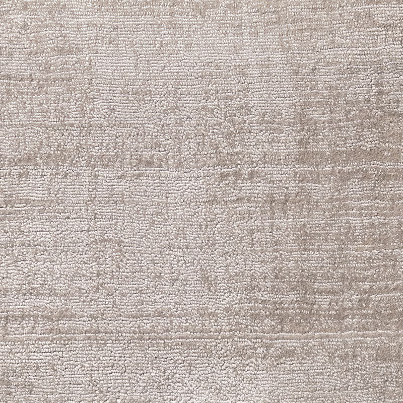 Warm ash-grey carpet pile with irregular horizontal striations and nubby texture
