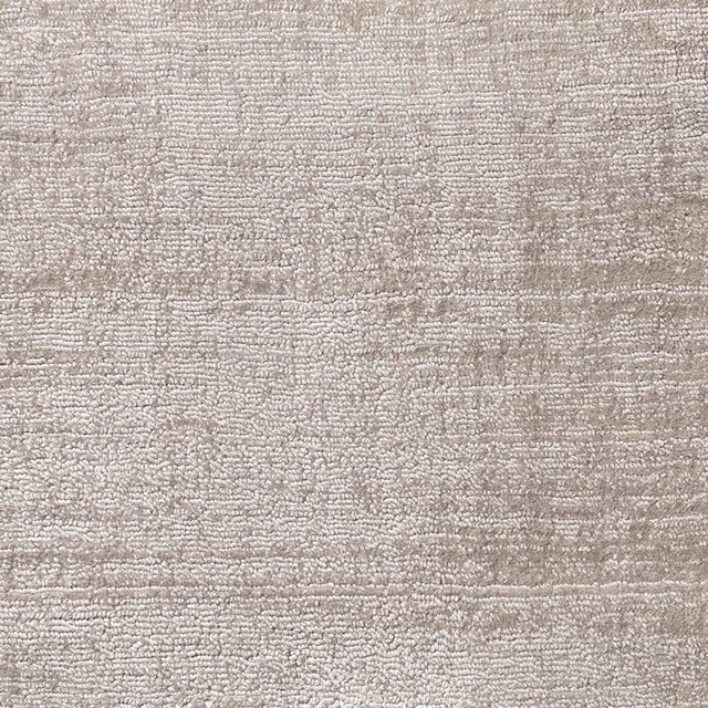 Warm ash-grey carpet pile with irregular horizontal striations and nubby texture