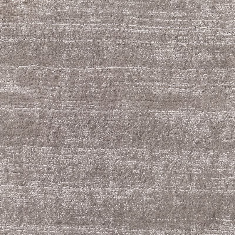 Warm dove-grey carpet textile with irregular horizontal bands and softly nubby woven texture