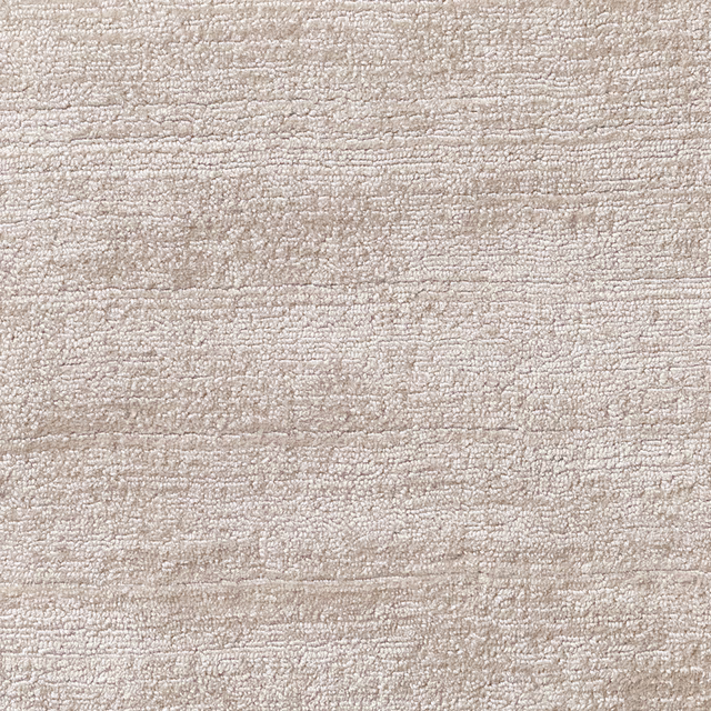 Pale platinum carpet with close-set looped texture and broken horizontal striations