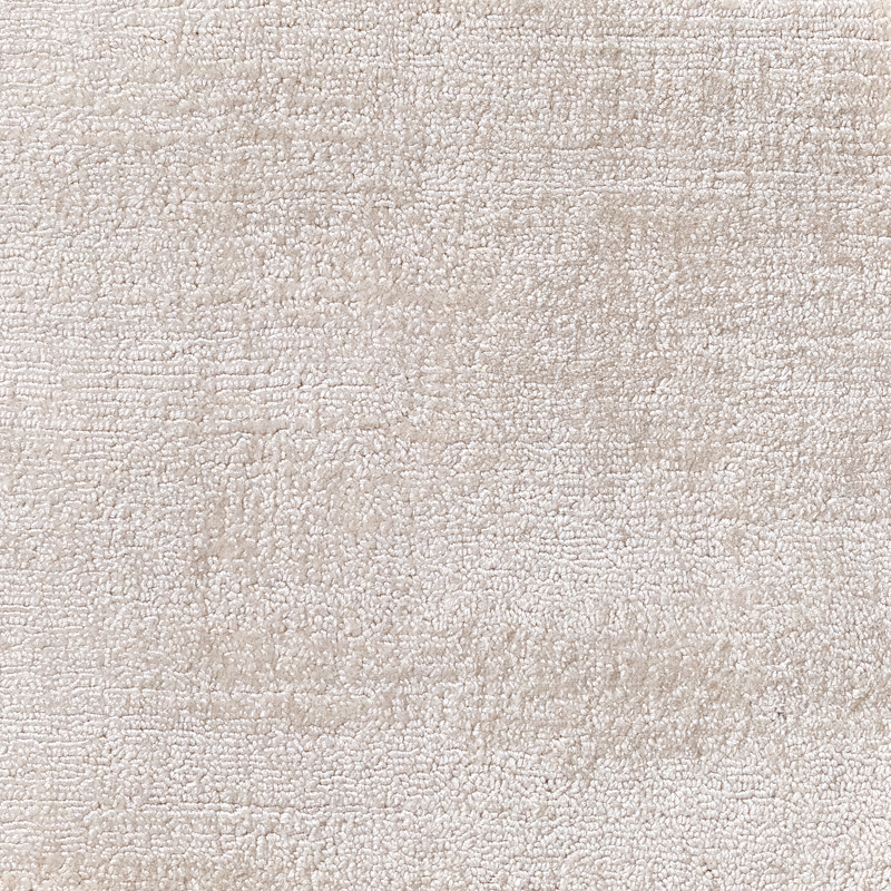 Warm ivory Shell carpet textile with dense nubby loops and subtle tonal bands