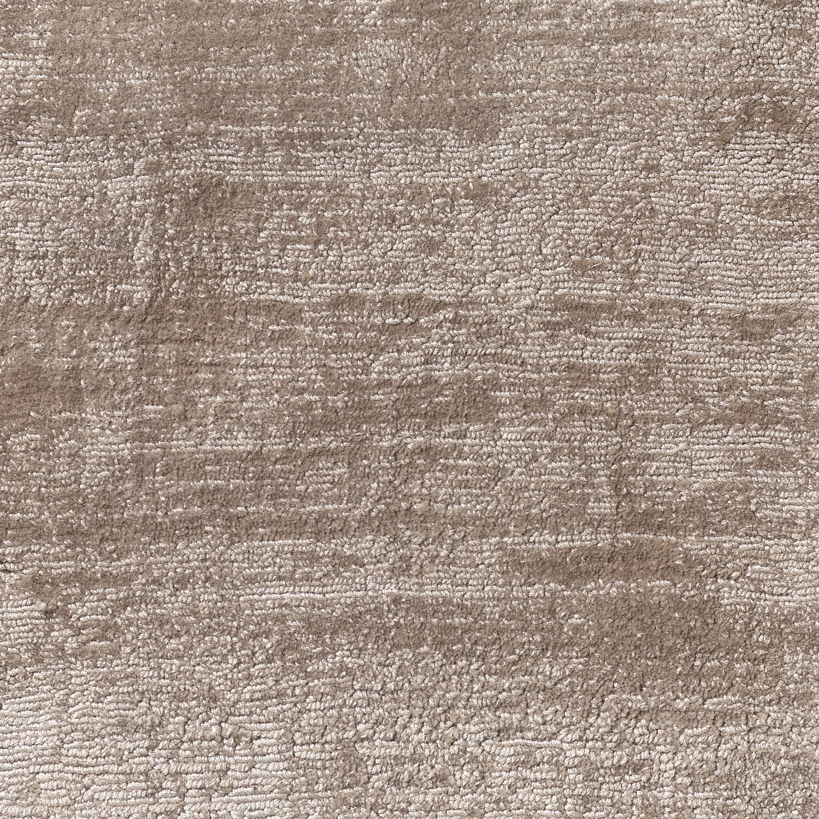 Mottled warm taupe carpet textile with dense horizontal nubby texture