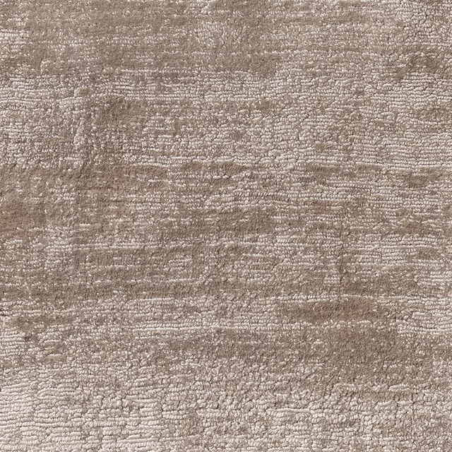 Mottled warm taupe carpet textile with dense horizontal nubby texture