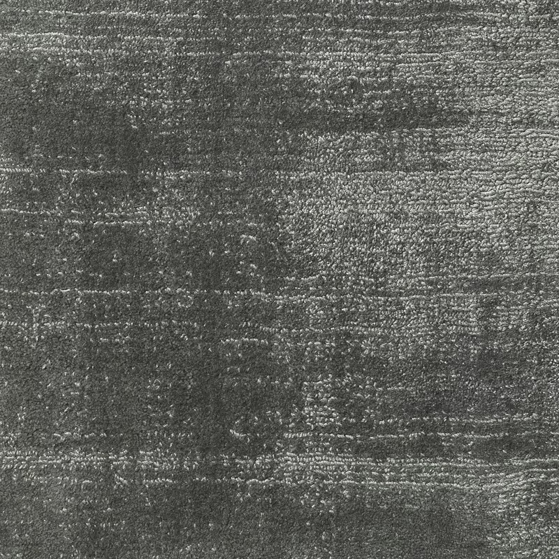 Charcoal-grey carpet texture with broken horizontal bands and silvery flecked highlights