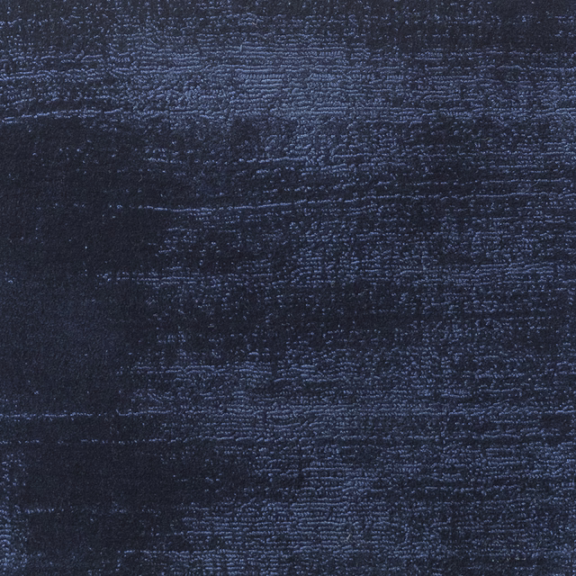 Deep navy textile with rippled horizontal texture and subtle blue highlights
