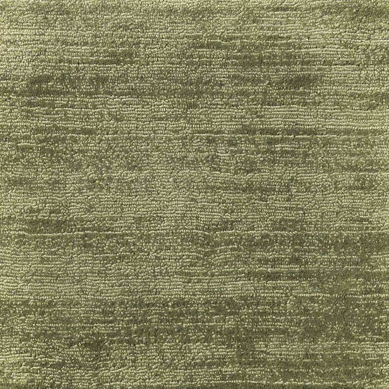 Close-up of muted sage-green textile with nubby horizontal texture and tonal olive shading