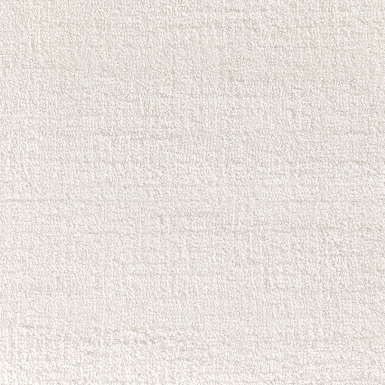 Close view of warm white nubby carpet texture with subtle woven tonal variation