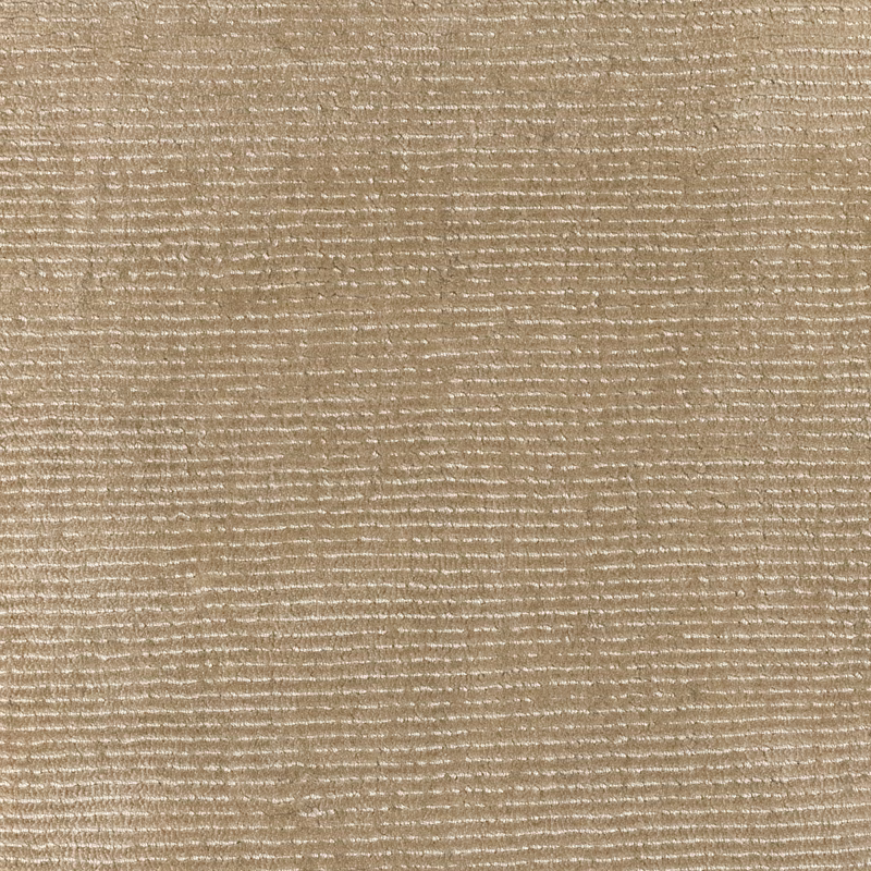 Warm wheat-beige woven surface with irregular horizontal ivory flecks and fine slubs