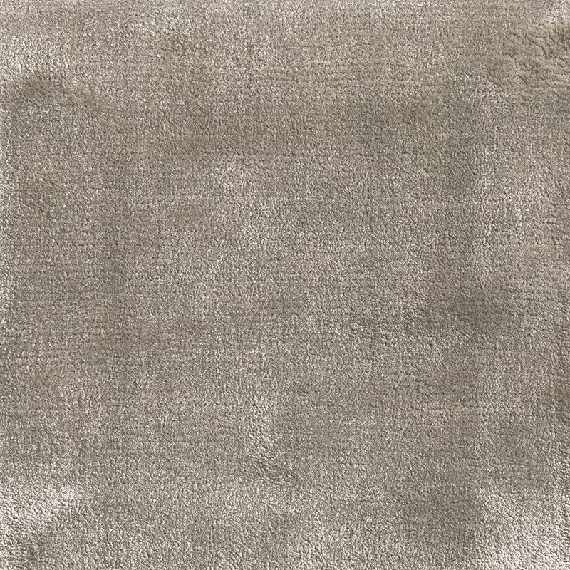 Warm cloudy grey carpet swatch with fine mottled texture and subtle tonal variation