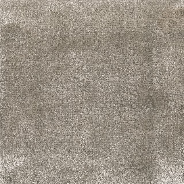 Warm cloudy grey carpet swatch with fine mottled texture and subtle tonal variation
