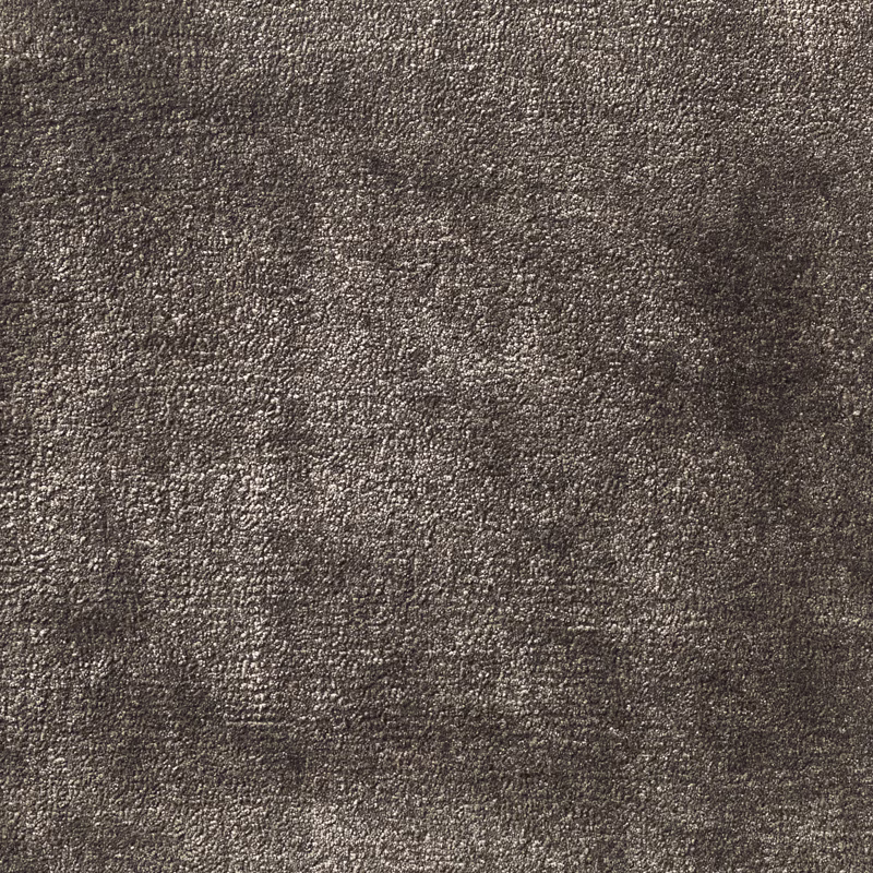 Close view of dense charcoal-grey carpet with subtle mottled texture and low relief