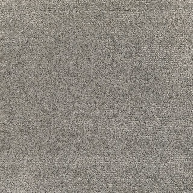 Close-up of muted warm-grey Artemisia carpet with softly mottled low texture