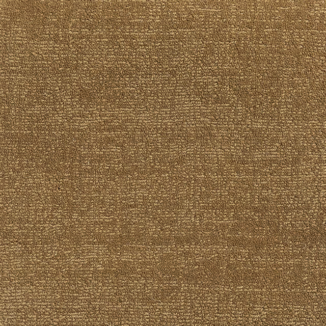 Close view of warm old-gold carpet weave with mottled ochre-brown texture