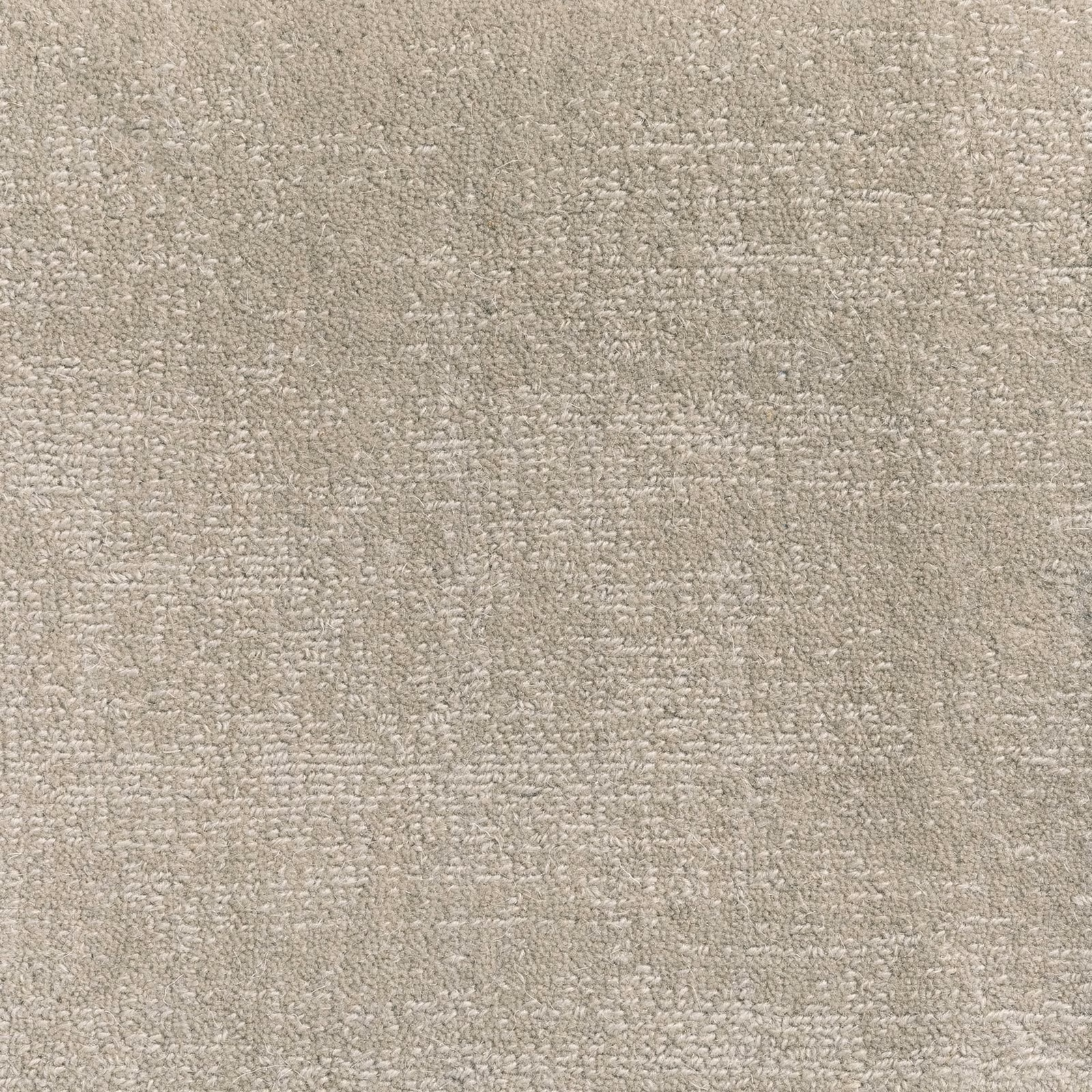 Soft stone-taupe carpet with dense looped texture and subtle mottled variation