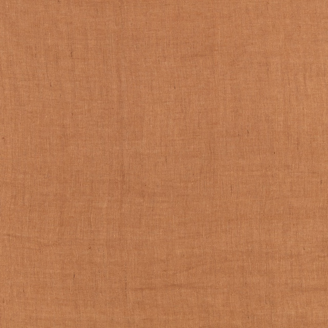 Warm sweet-potato terracotta plain weave with fine slubs and subtle tonal variation