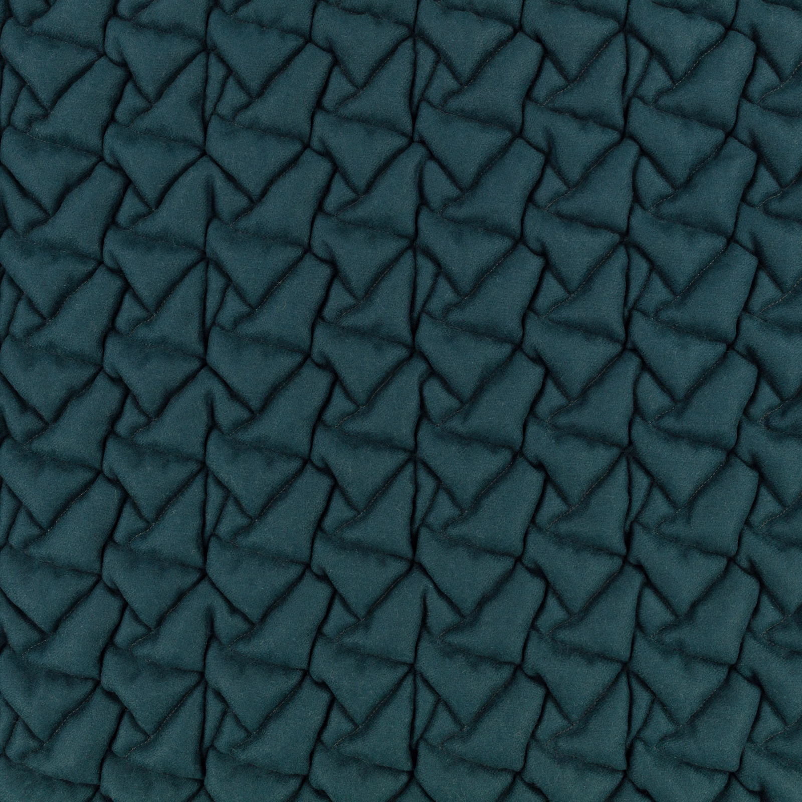 Deep kingfisher teal textile with raised, irregular geometric quilted texture