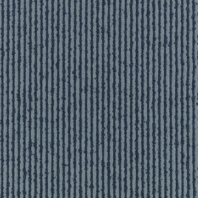 Muted denim-blue fabric with irregular dark vertical stripes and a raised ribbed texture