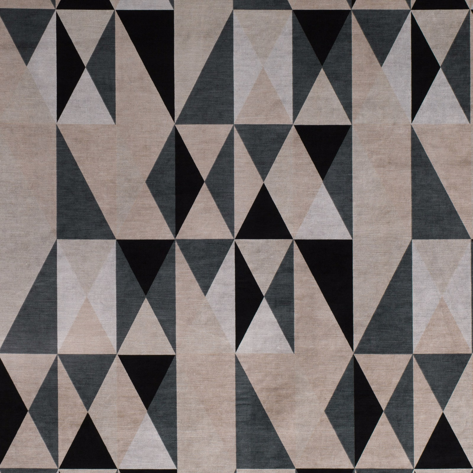 Warm biscuit geometric fabric with black, charcoal and pale grey triangular motifs