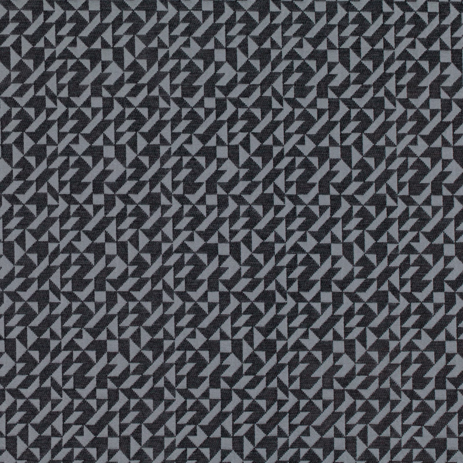Charcoal and grey woven fabric with dense repeating triangular geometry