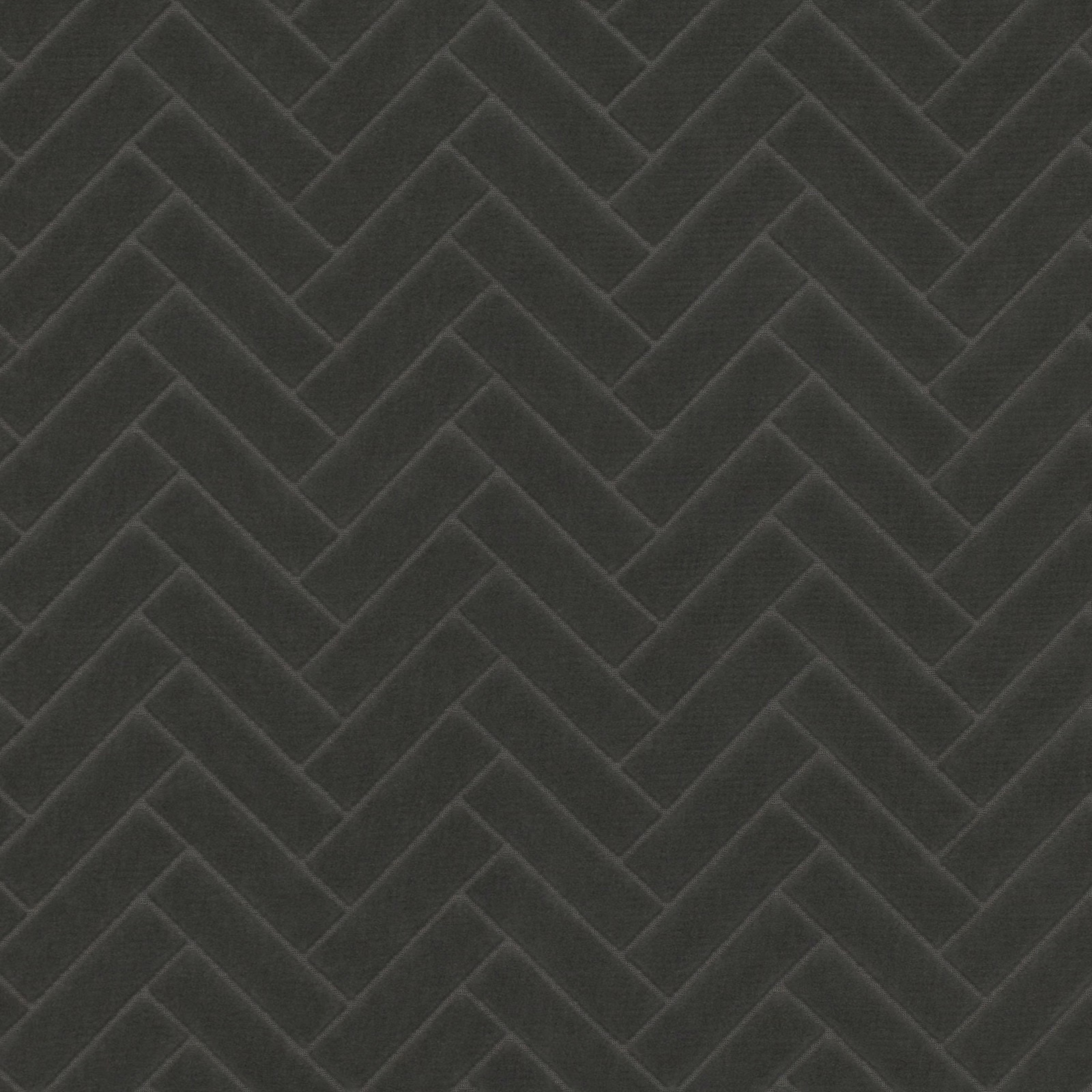 Deep charcoal textile with tonal chevron ridges and a softly textured surface