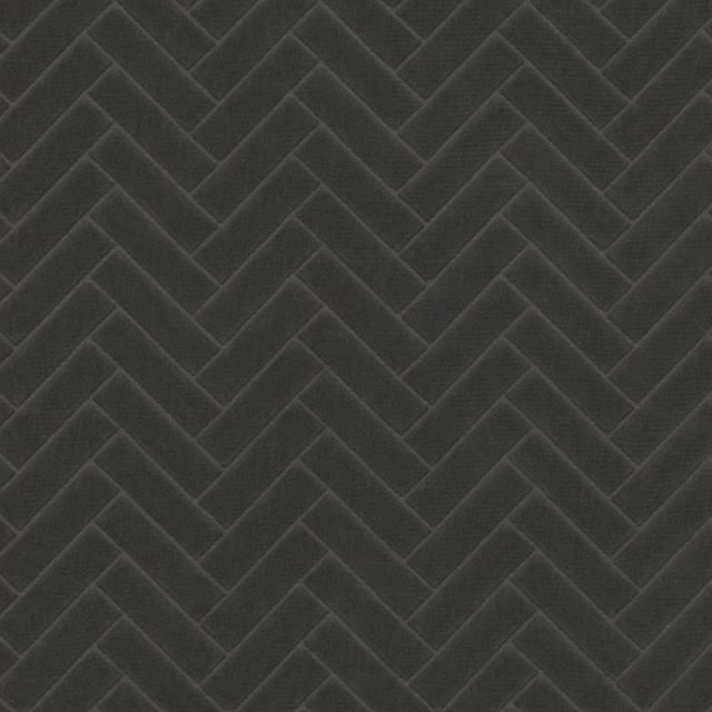 Deep charcoal textile with tonal chevron ridges and a softly textured surface