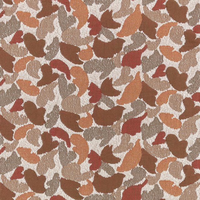 Terracotta, rust, brown and cream abstract leaf-like woven textile close-up
