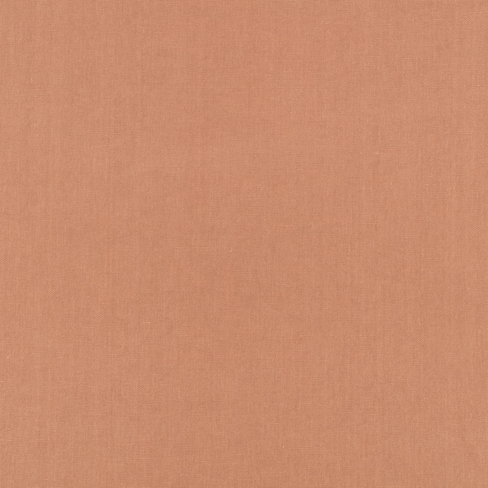 Close-up of muted salmon-pink plain weave with a soft, lightly varied texture