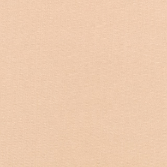 Warm nude-peach plain fabric with a barely visible fine woven texture