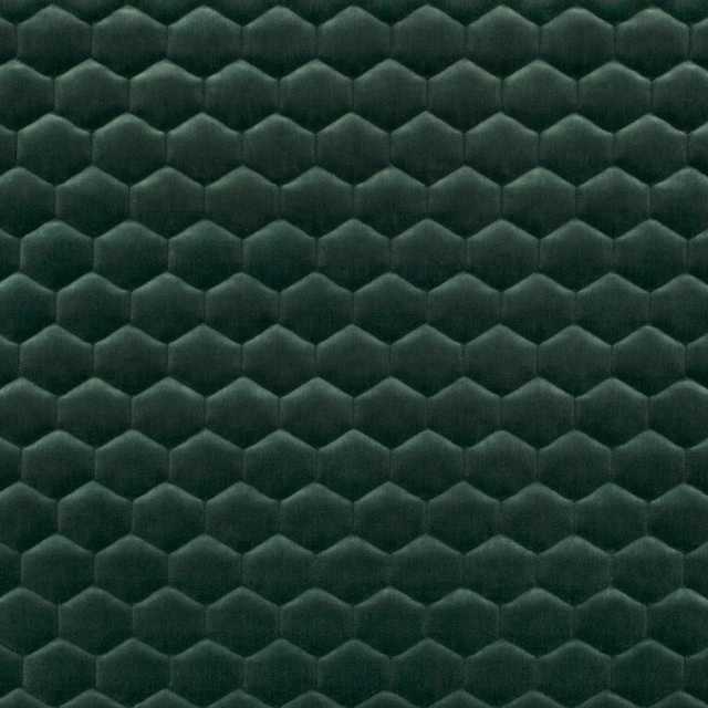 Deep evergreen plush textile with repeating scalloped hexagonal relief
