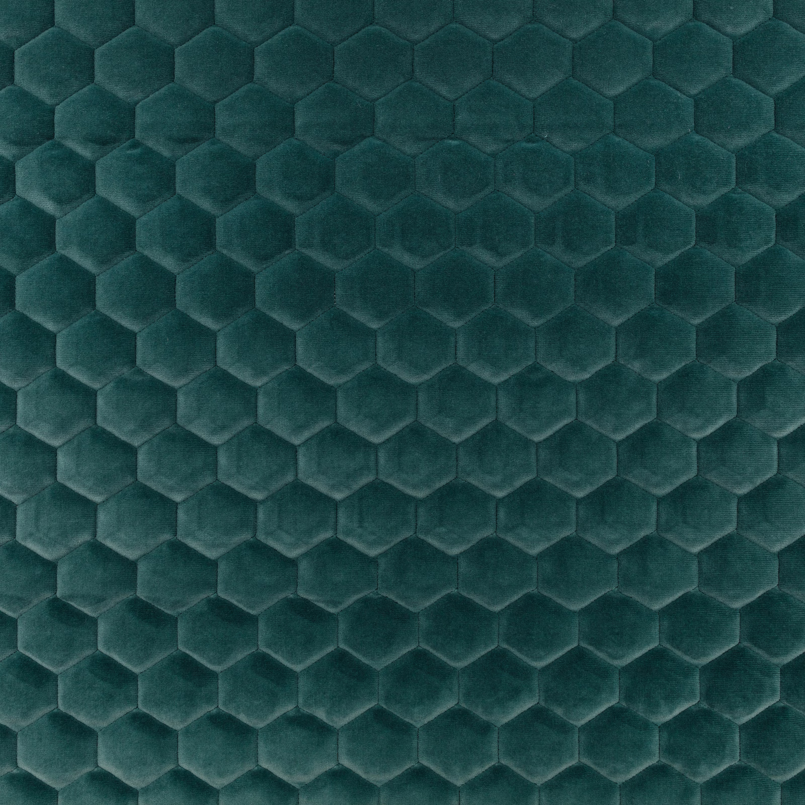 Deep peacock teal fabric with raised hexagonal honeycomb texture and soft tonal sheen