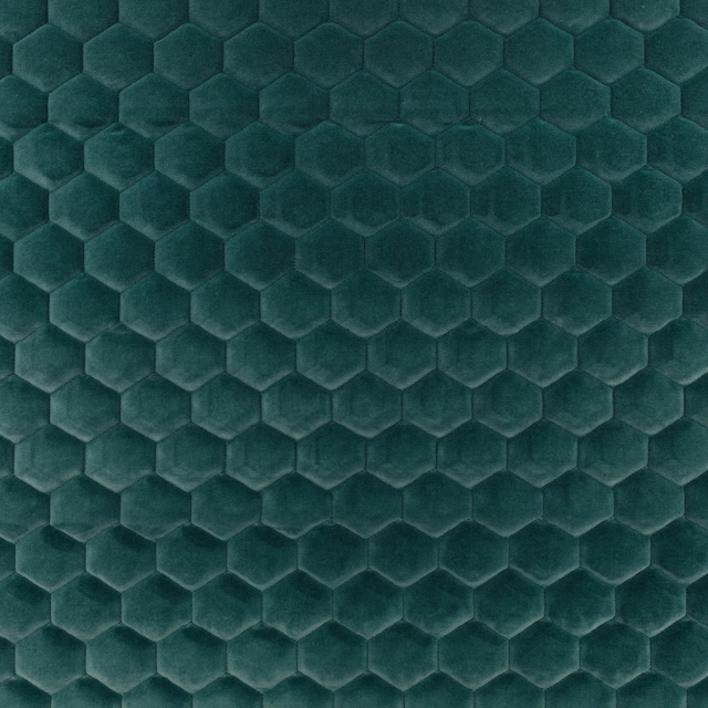Deep peacock teal fabric with raised hexagonal honeycomb texture and soft tonal sheen
