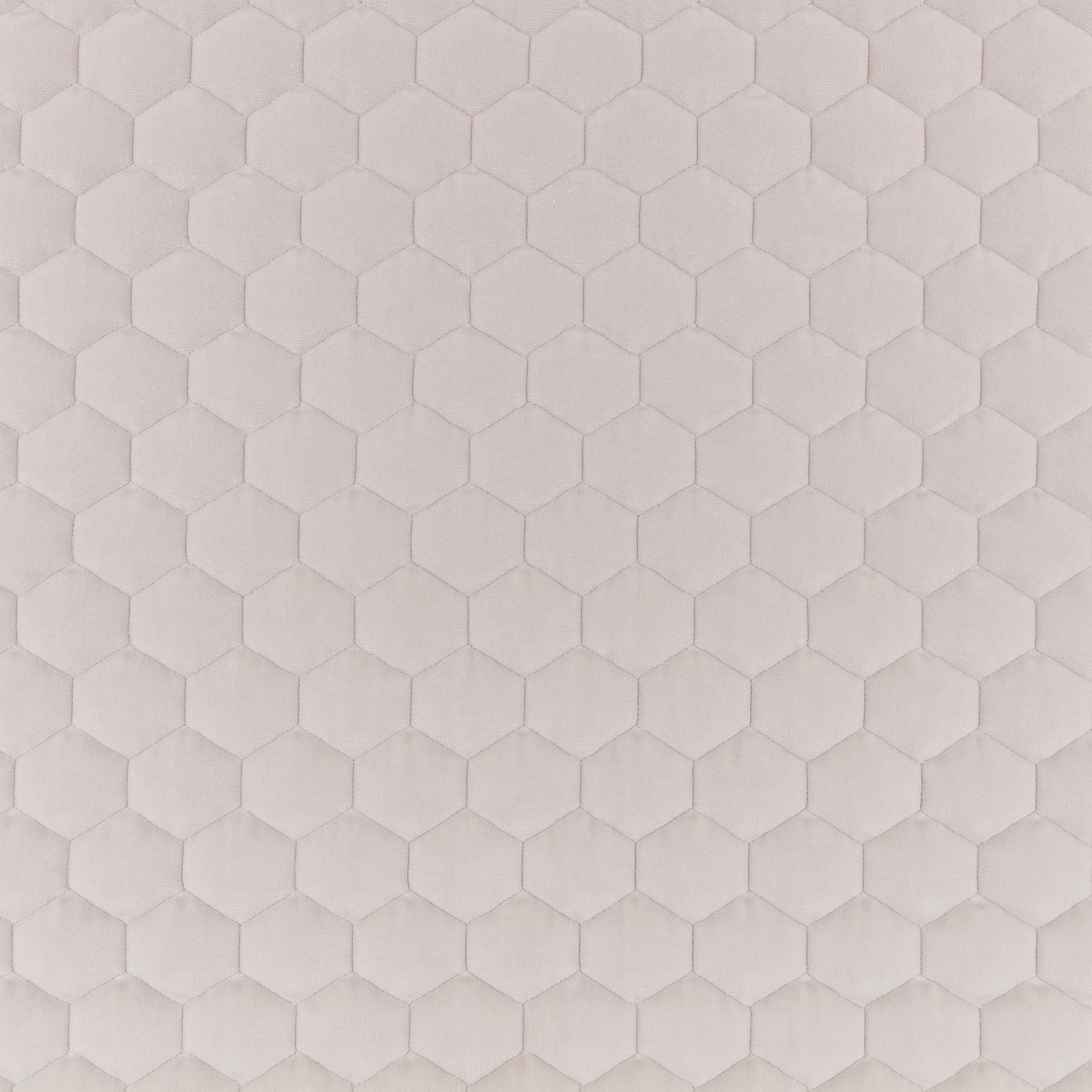 Pale warm-taupe fabric with softly raised repeating hexagonal honeycomb texture