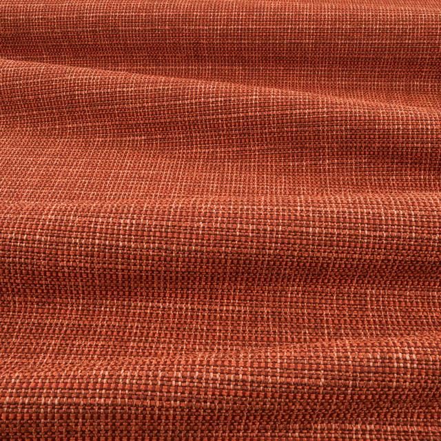Burnt blood-orange woven textile with dense crosshatched texture and darker rust folds