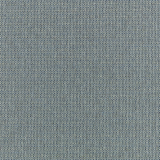 Close-up of muted indigo fabric with a tiny pale-and-blue woven check texture
