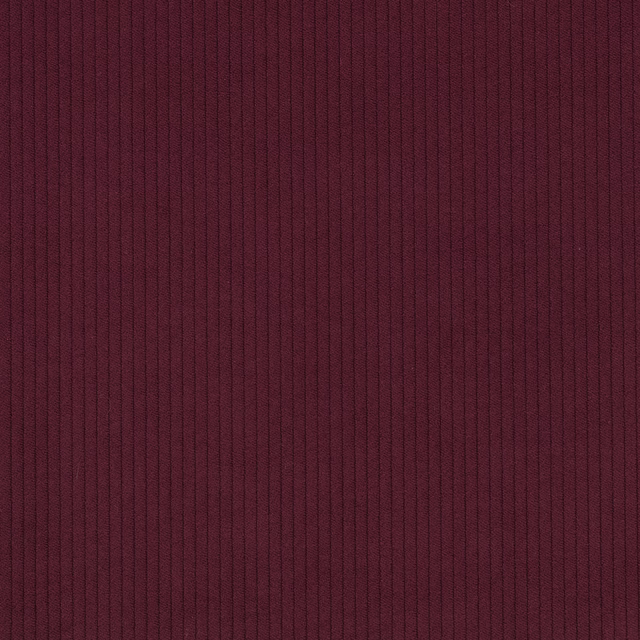 Deep aubergine corduroy with closely spaced vertical ribs and a subtle matte sheen
