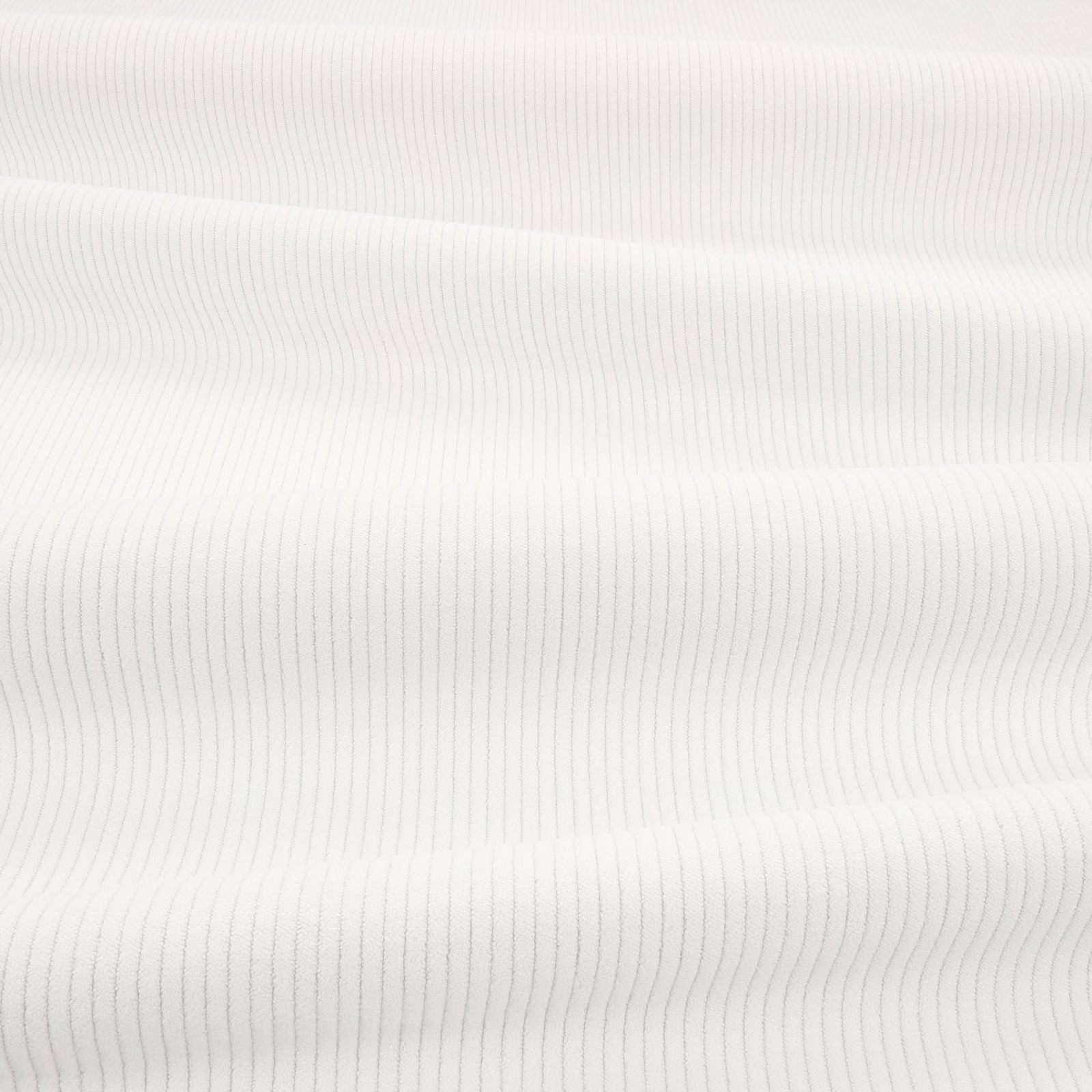Porcelain off-white fabric with fine vertical cord ribs and soft shadowing