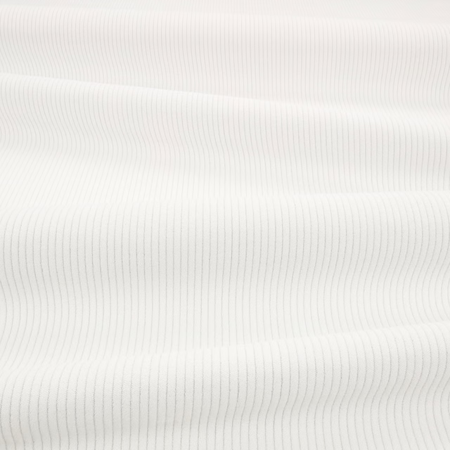 Porcelain off-white fabric with fine vertical cord ribs and soft shadowing