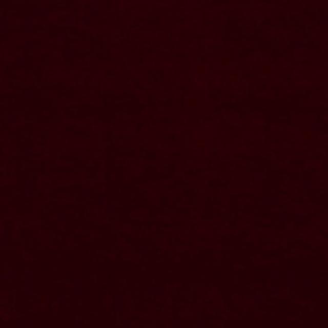 Near-black claret-red swatch with a barely visible, softly textured surface